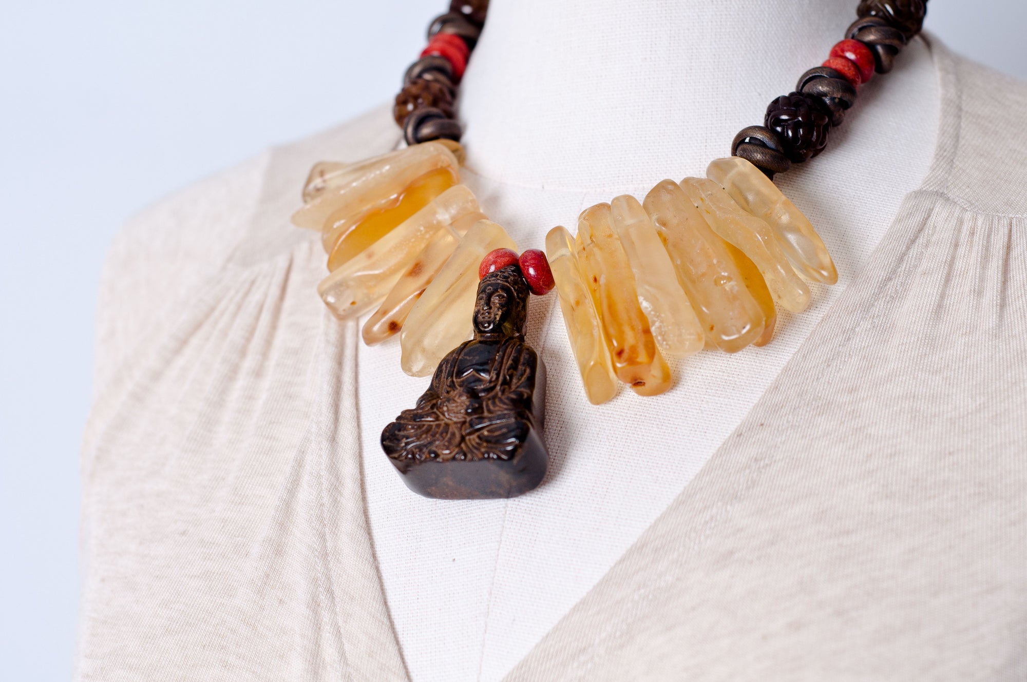 Amber coral jade Buddha necklace. Cristina Tamames Jewelry Designer