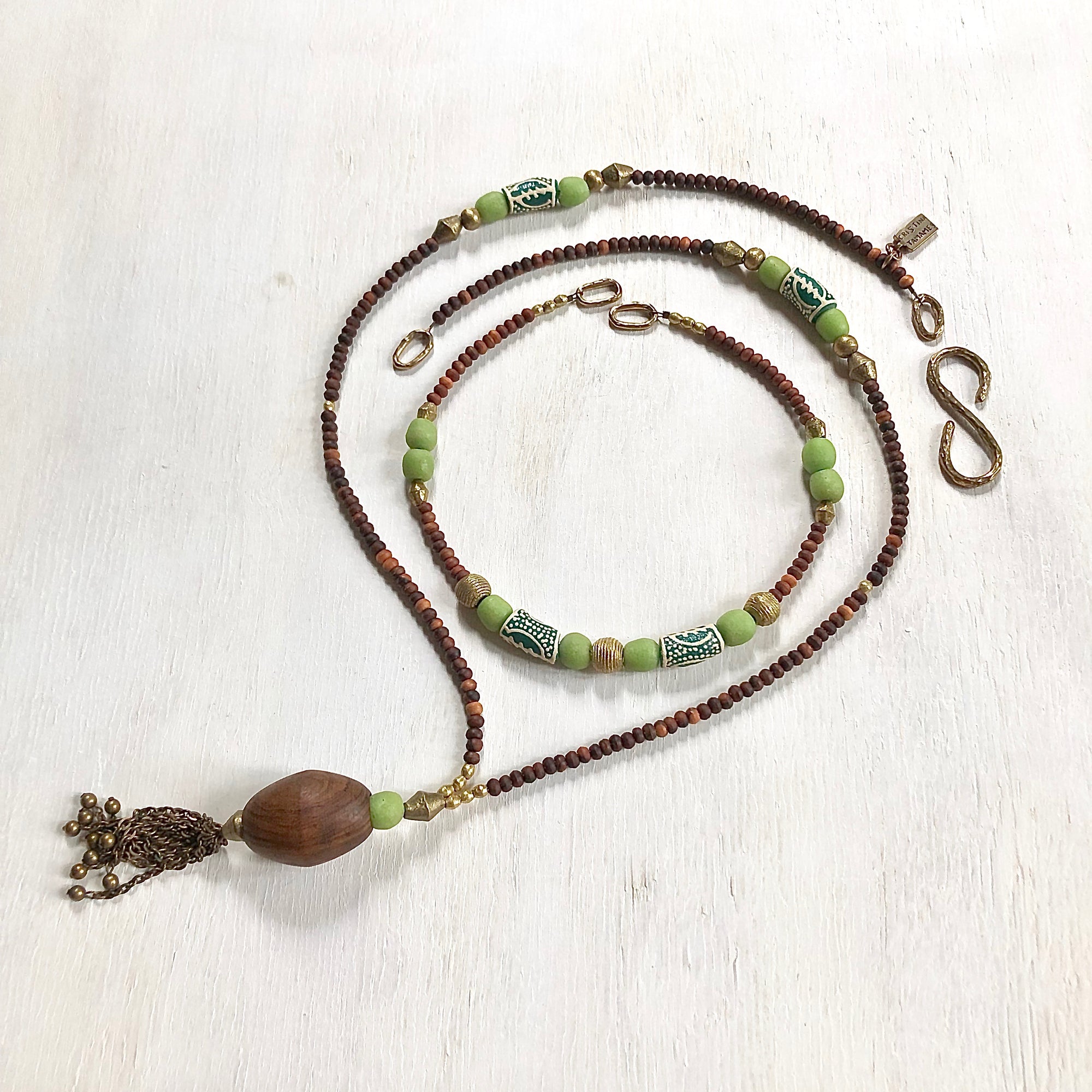 Hand painted green Adinkra African beads with vintage olive wood pendant long necklace. Cristina Tamames Jewelry Designer