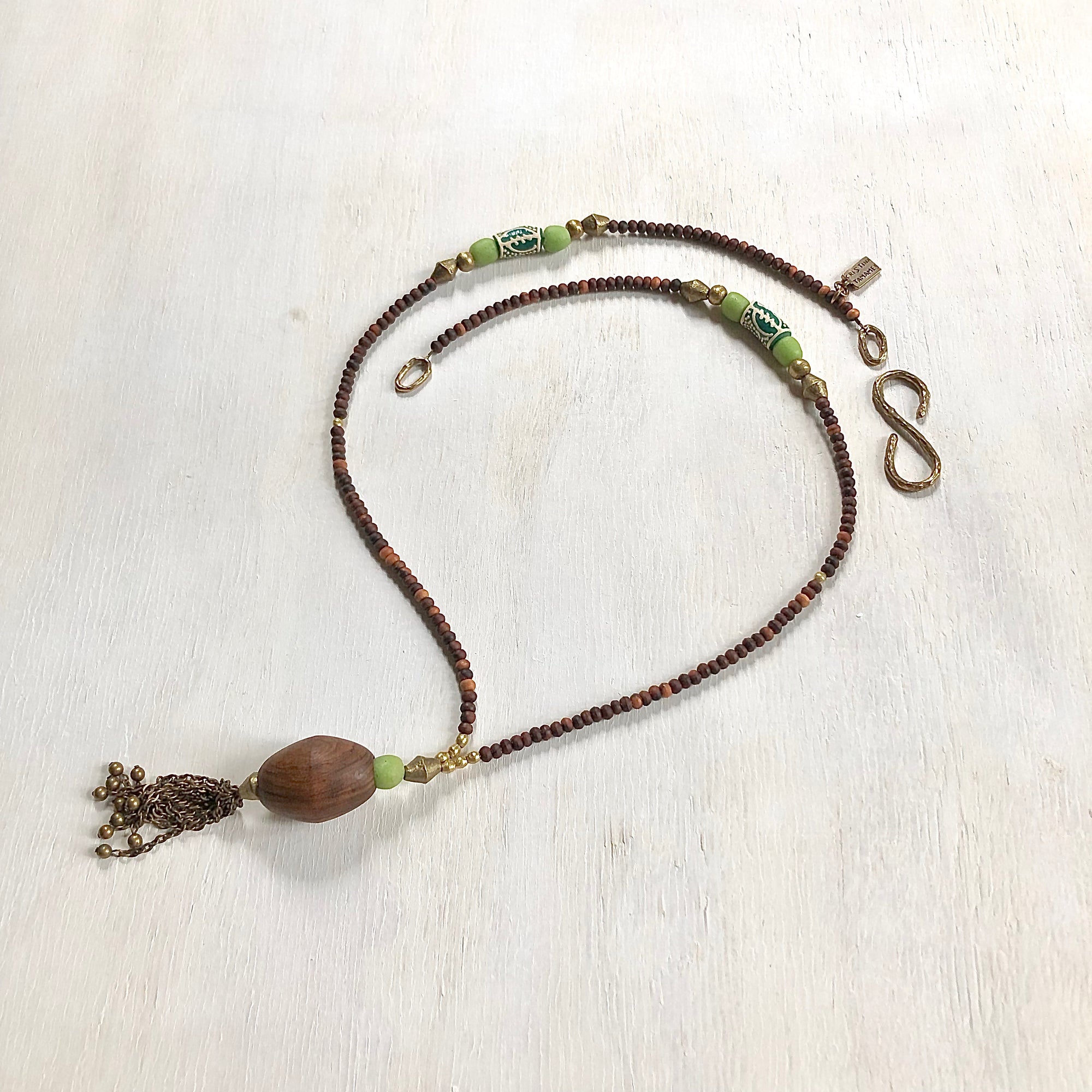 Hand painted green Adinkra African beads with vintage olive wood pendant long necklace. Cristina Tamames Jewelry Designer