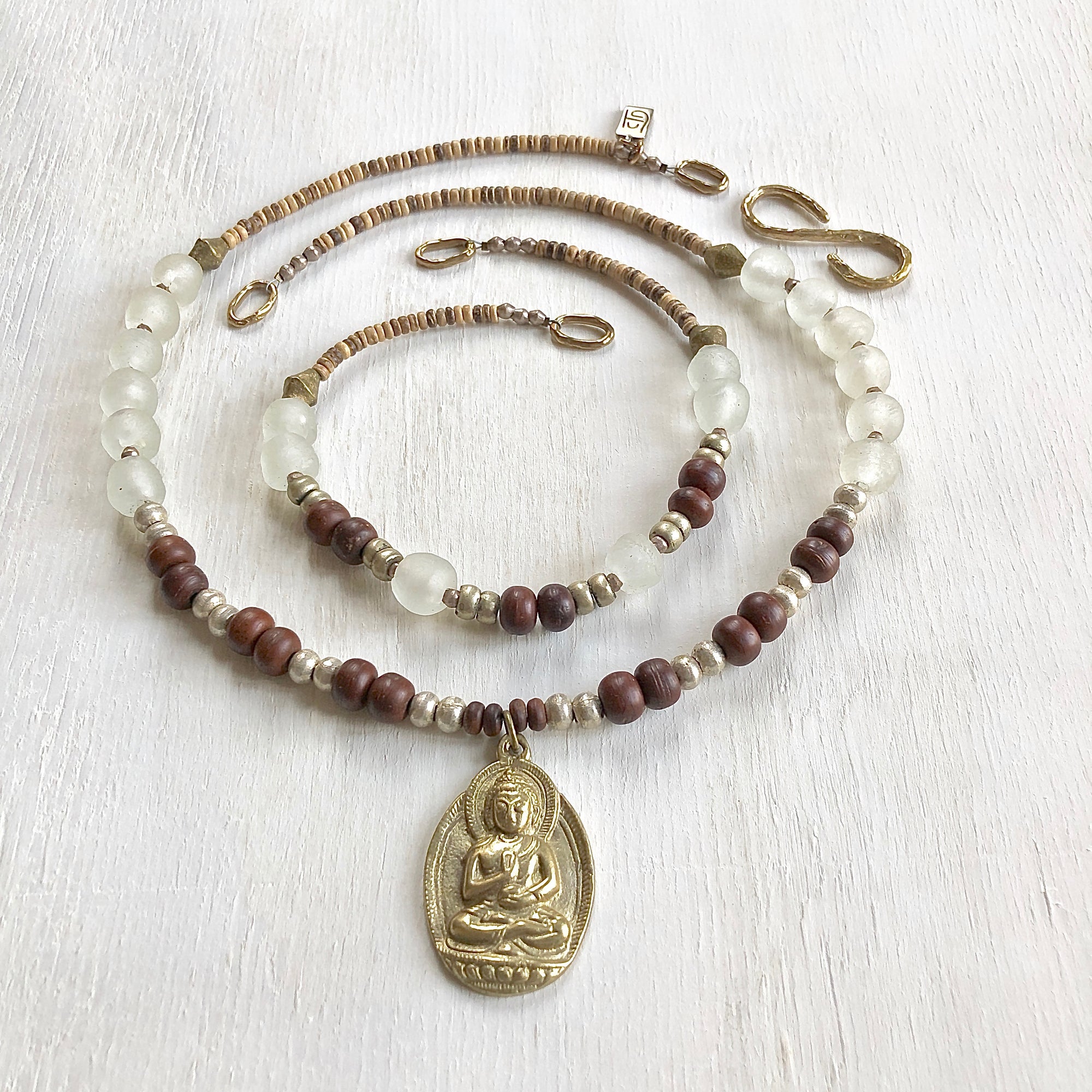 African recycled bottle beads brass Buddha double necklace. Cristina Tamames Jewelry Designer