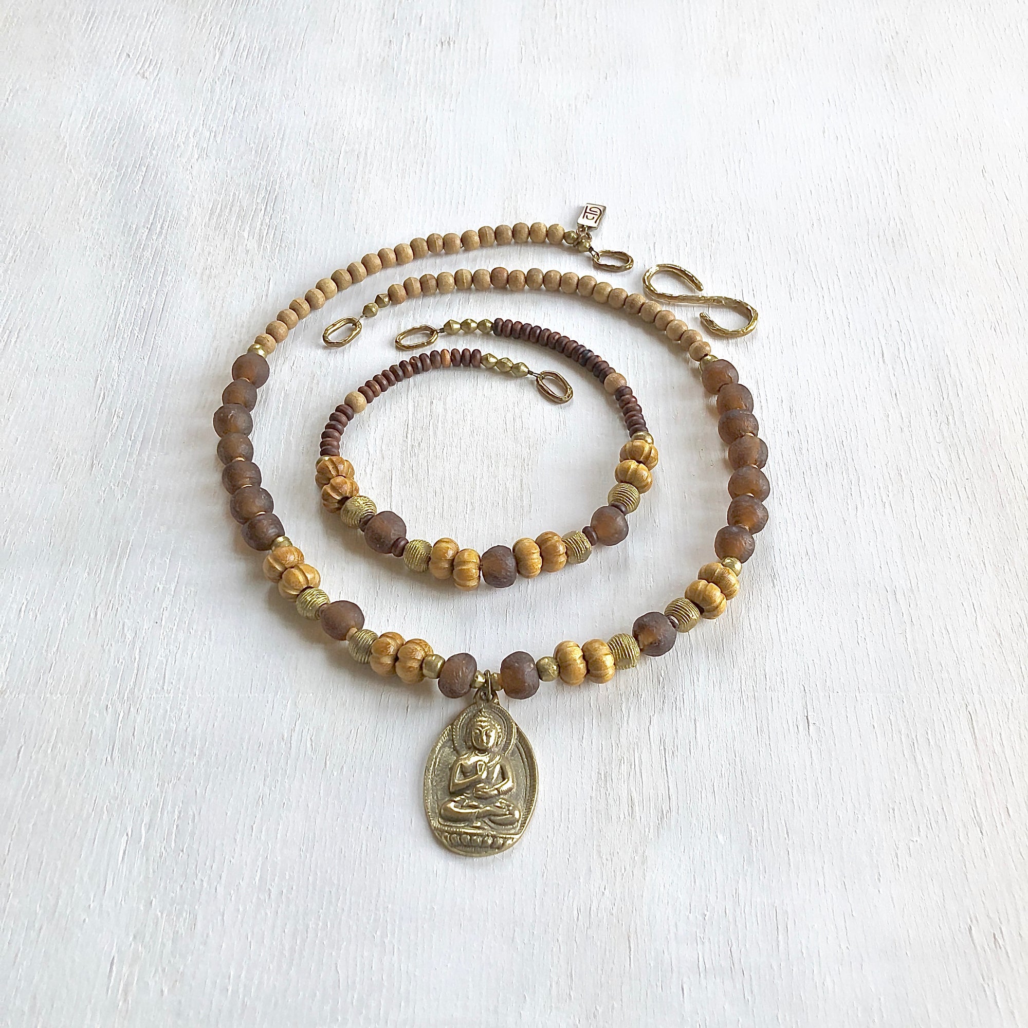 African recycled bottle beads brass Buddha double necklace. Cristina Tamames Jewelry Designer