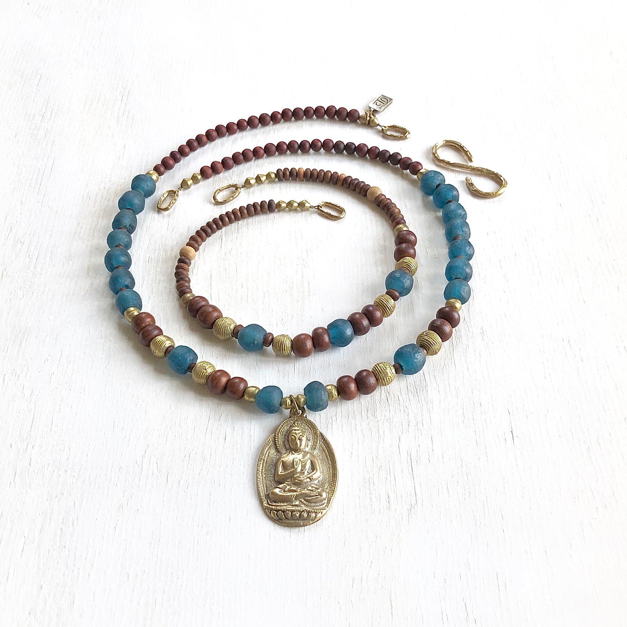 African recycled bottle beads brass Buddha double necklace. Cristina Tamames Jewelry Designer