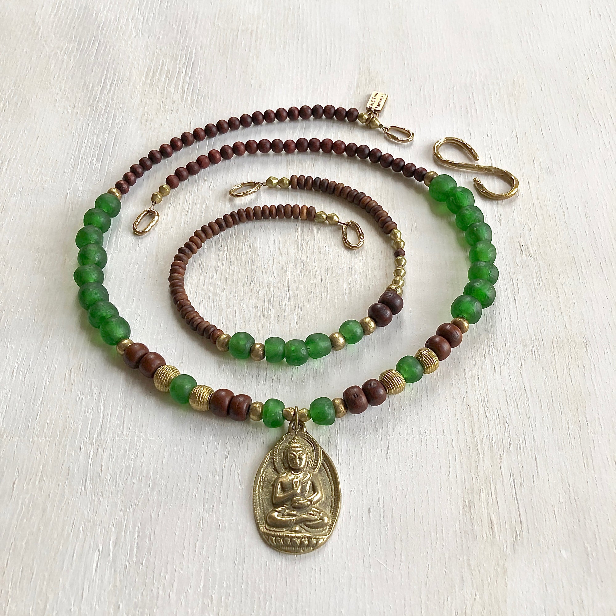 African recycled bottle beads brass Buddha double necklace. Cristina Tamames Jewelry Designer