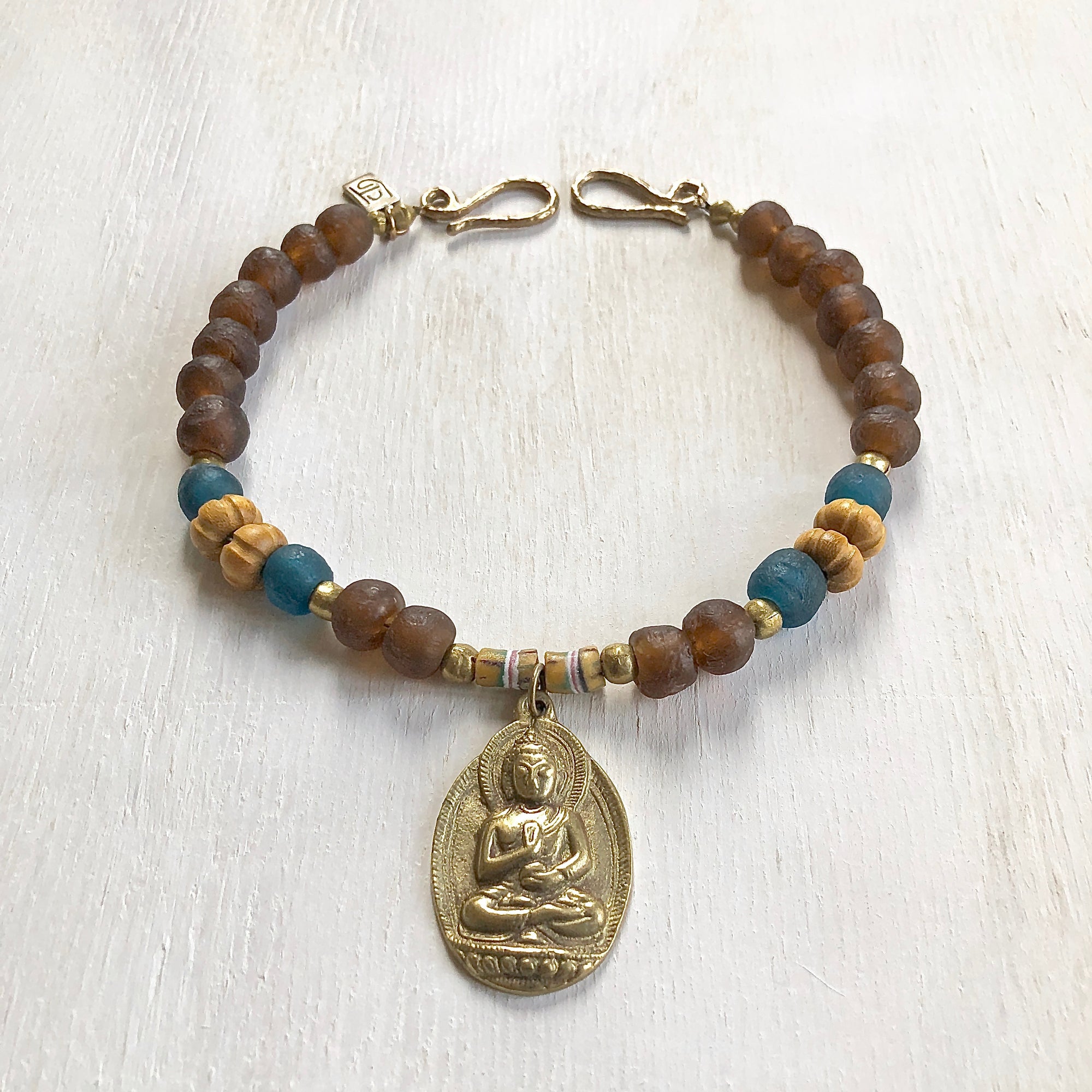 African recycled bottle beads brass Buddha necklace. Cristina Tamames Jewelry Designer