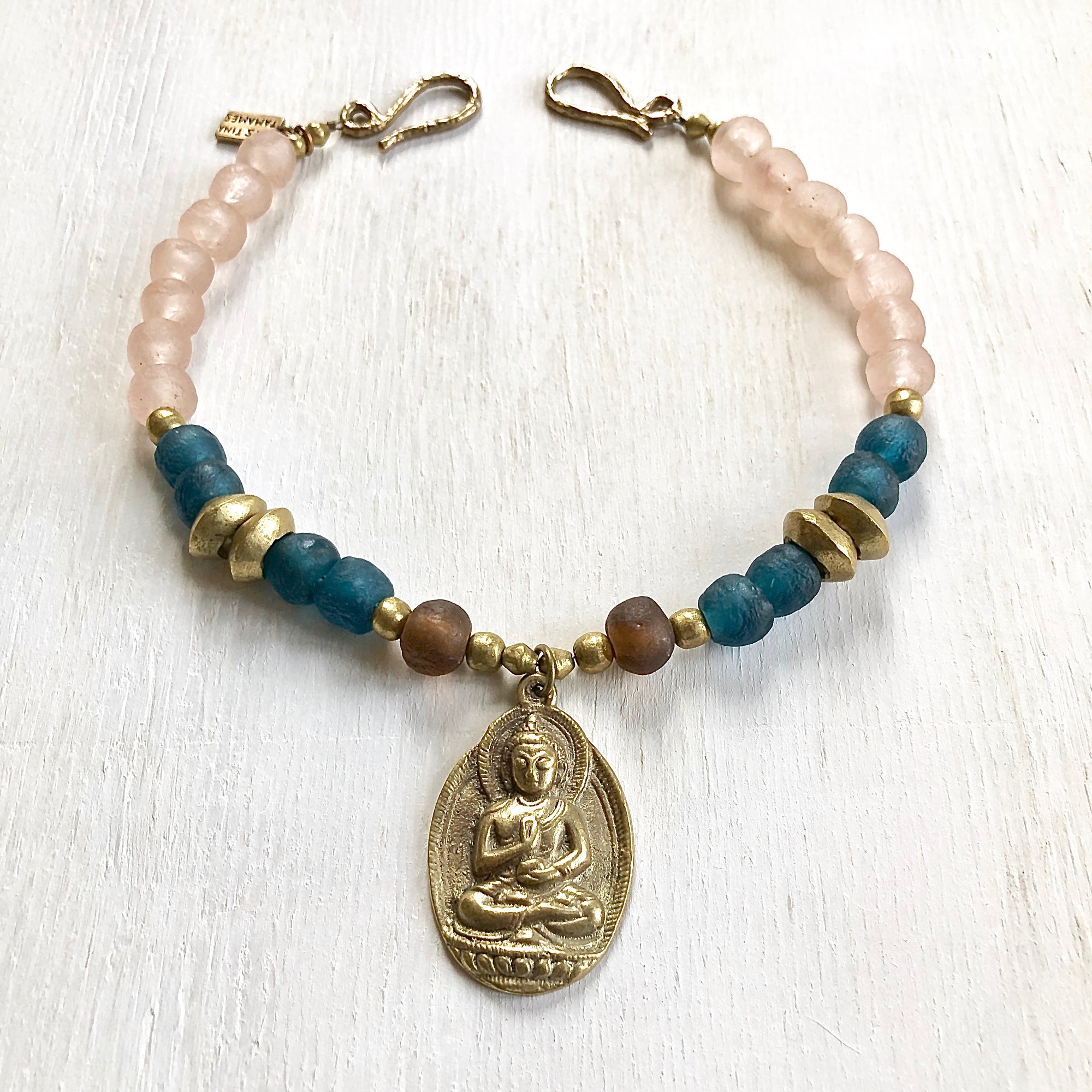 African recycled bottle beads brass Buddha necklace. Cristina Tamames Jewelry Designer