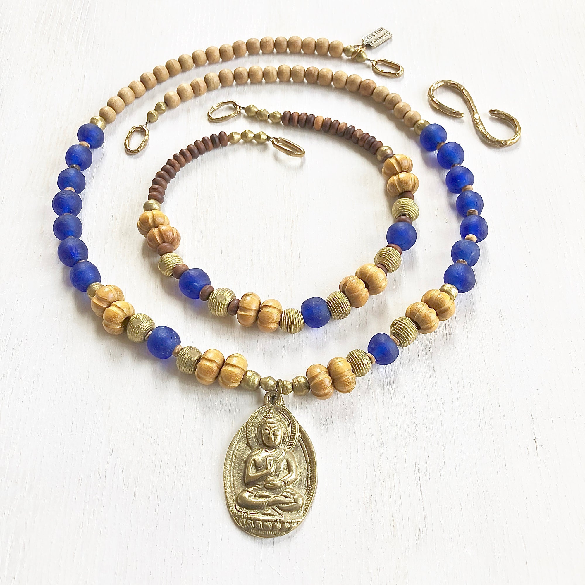 African recycled bottle beads brass Buddha double necklace. Cristina Tamames Jewelry Designer