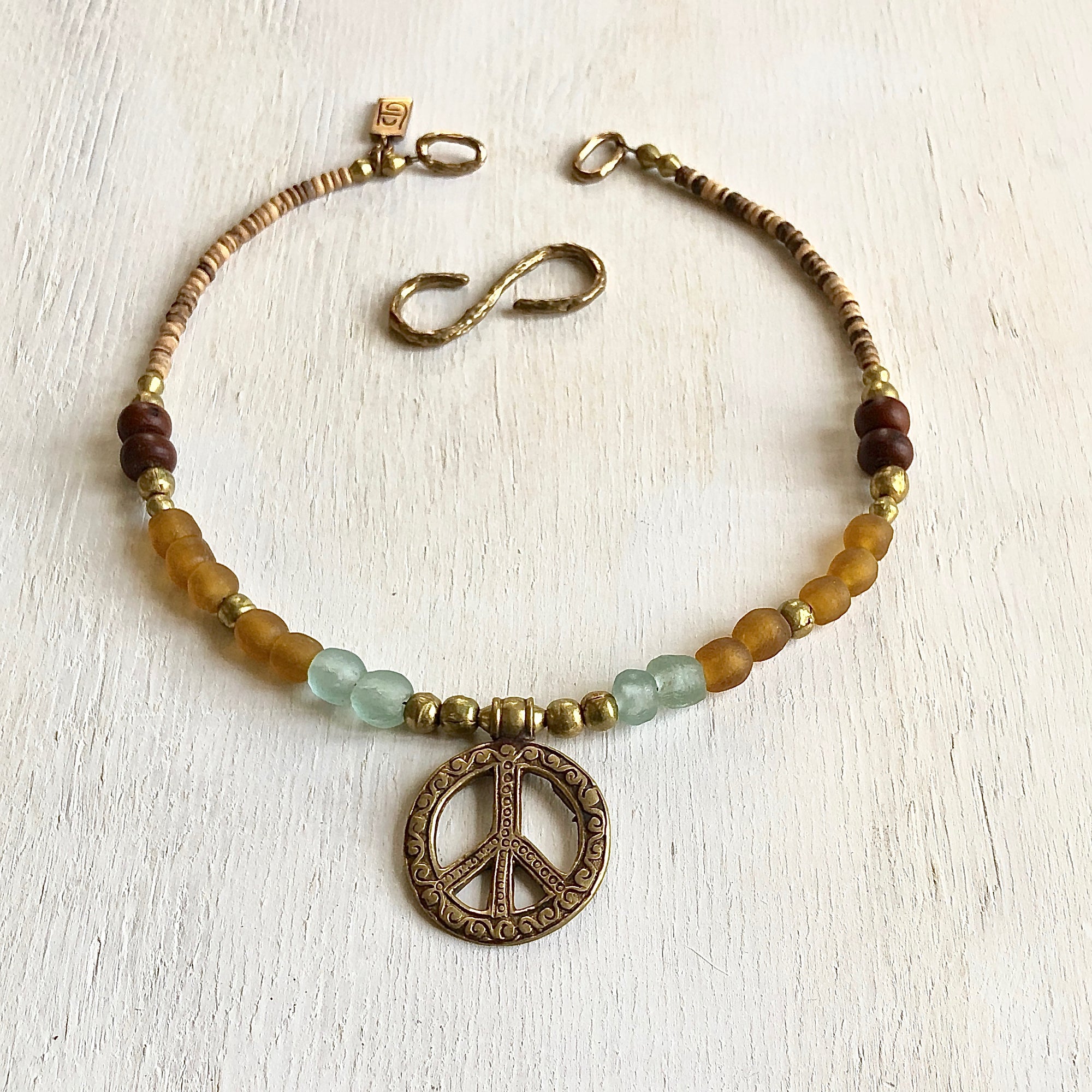African recycled bottle beads peace necklace. Cristina Tamames Jewelry designer