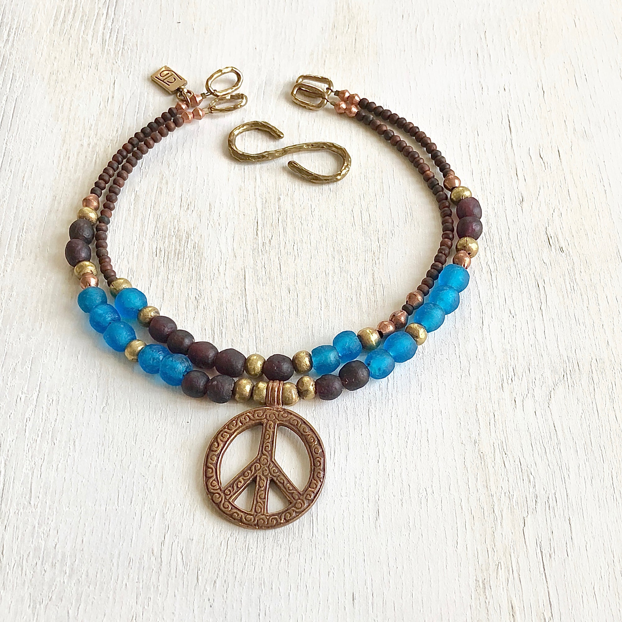 African recycled bottle beads peace necklace. Cristina Tamames Jewelry Designer