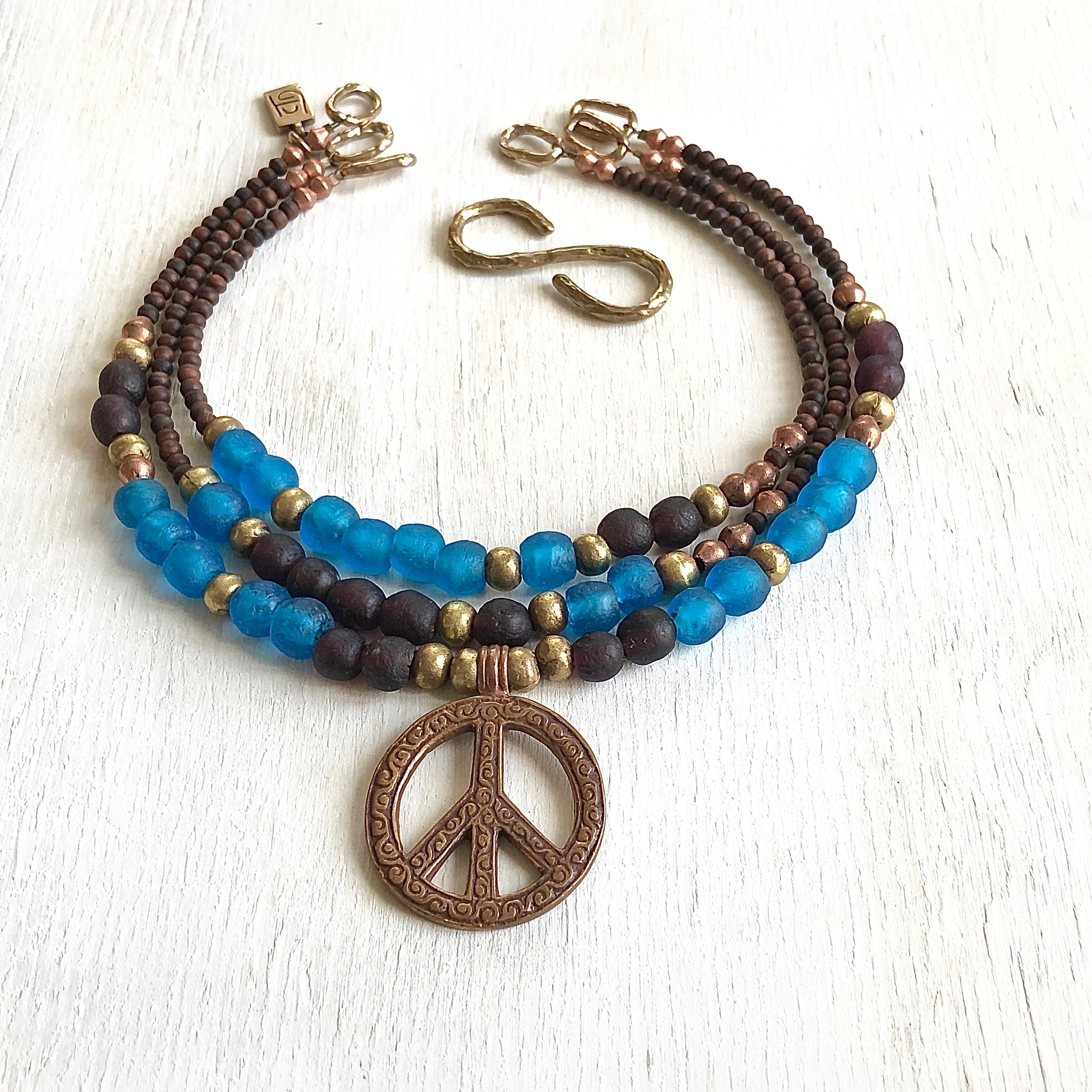 African recycled bottle beads peace necklace. Cristina Tamames Jewelry Designer