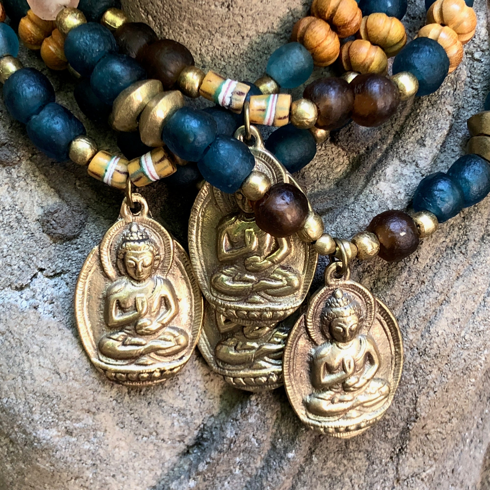 African recycled bottle beads brass Buddha double necklace. Cristina Tamames Jewelry Designer