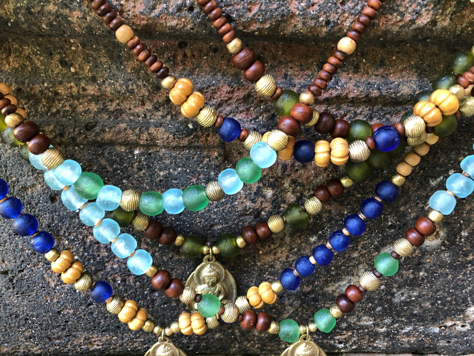 African recycled bottle beads brass Buddha double necklace. Cristina Tamames Jewelry Designer