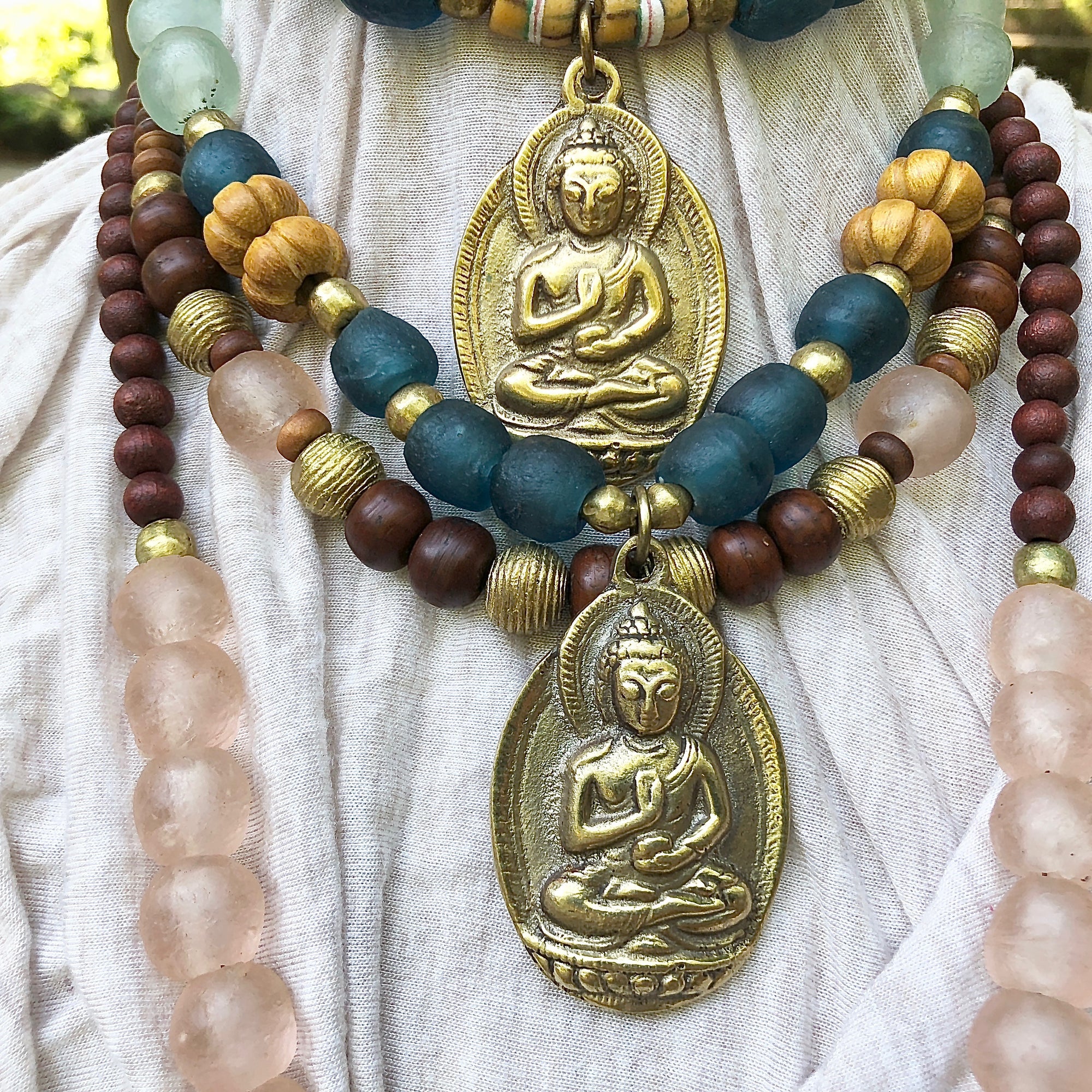 African recycled bottle beads brass Buddha double necklace. Cristina Tamames Jewelry Designer