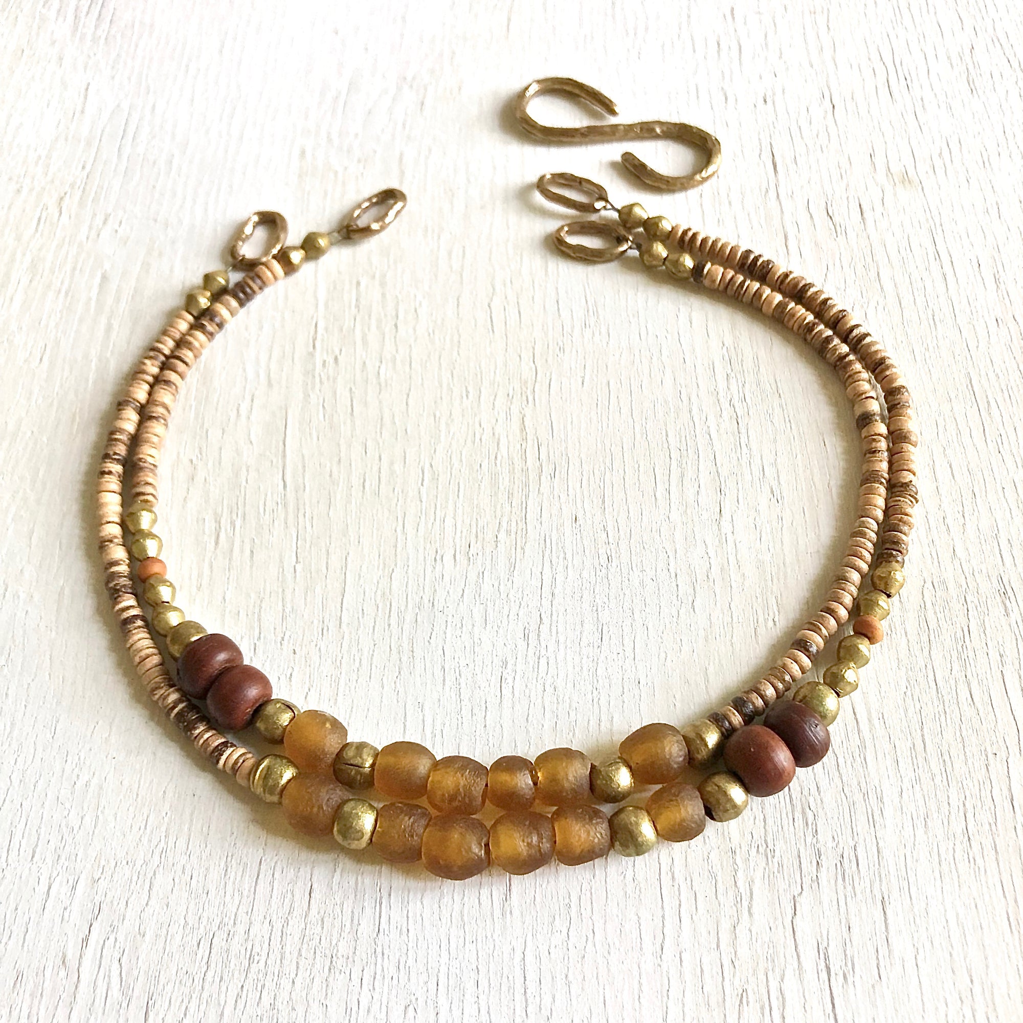 African recycled bottle beads peace necklace. Cristina Tamames Jewelry designer