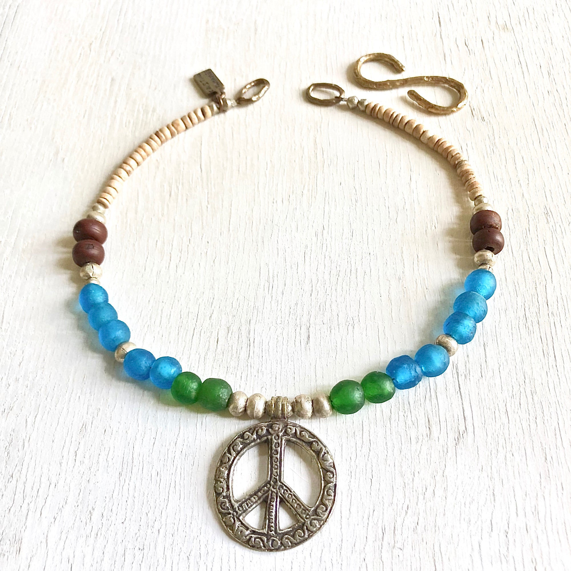 African recycled bottle beads peace necklace. Cristina Tamames Jewelry Designer