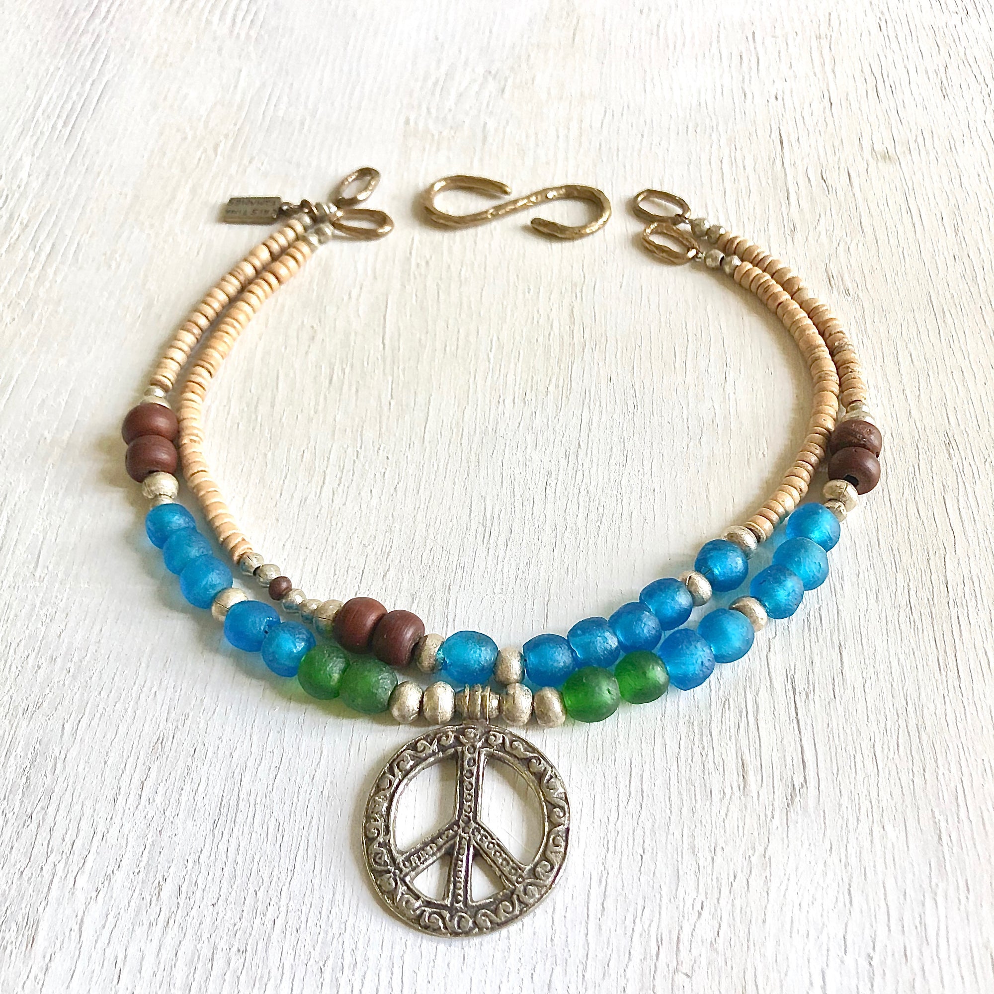 African recycled bottle beads peace necklace. Cristina Tamames Jewelry Designer