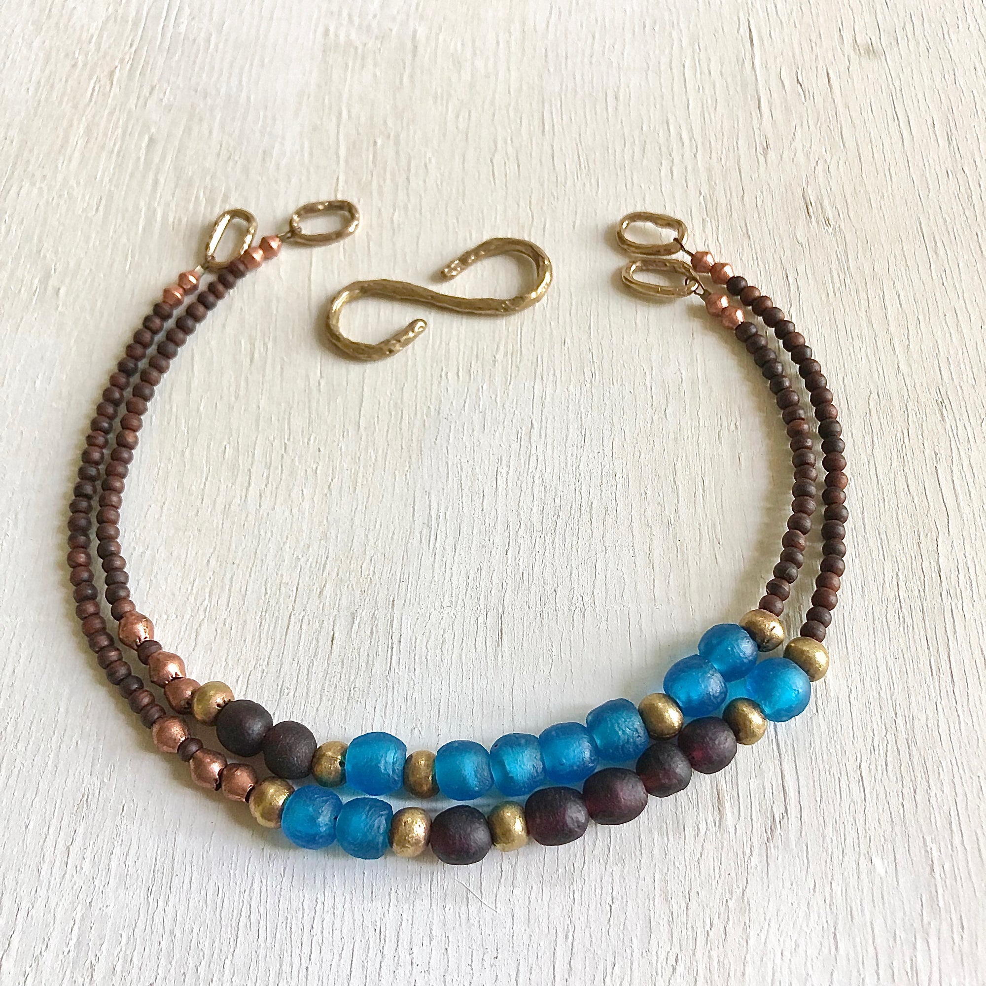 African recycled bottle beads peace necklace. Cristina Tamames Jewelry Designer