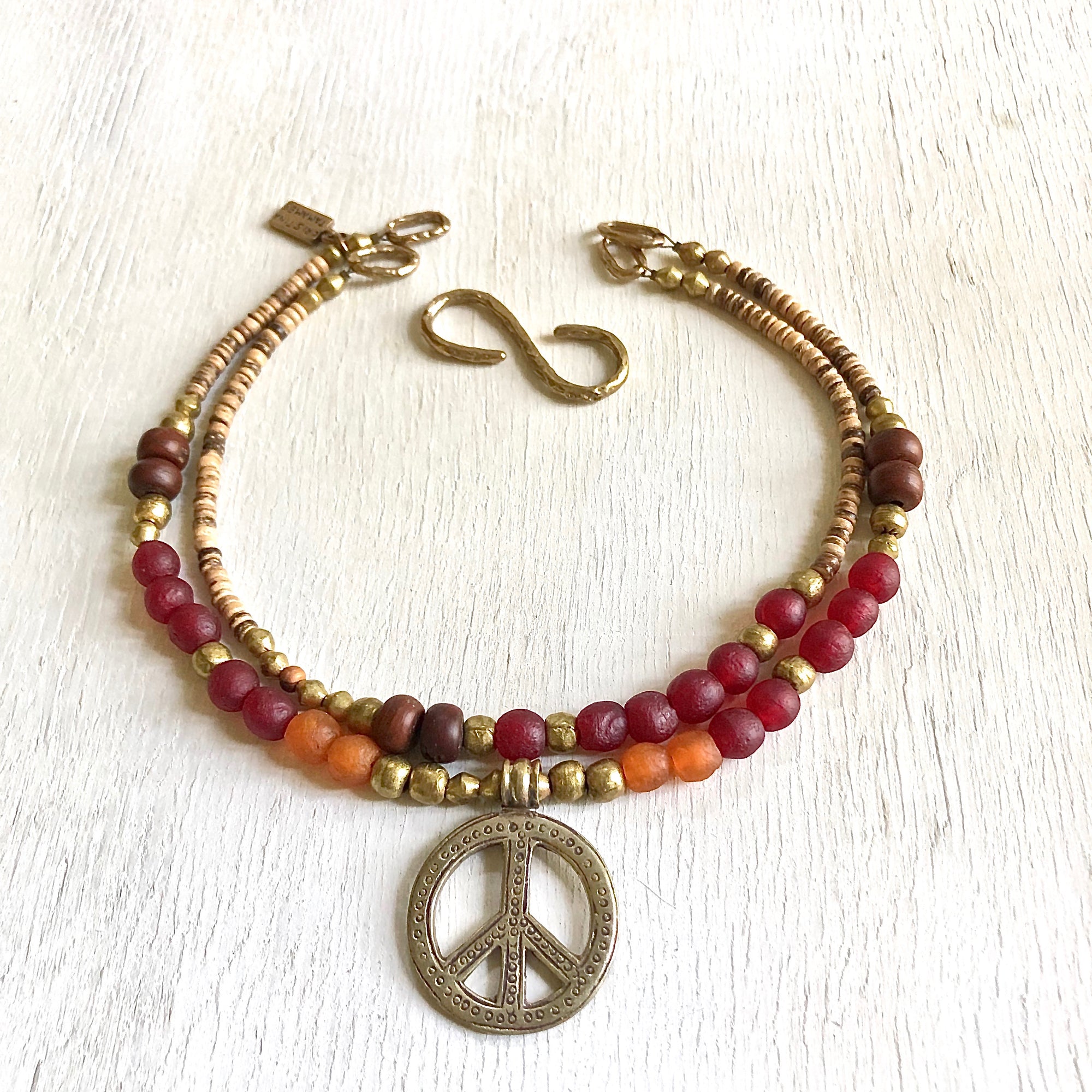 African recycled bottle beads peace necklace. Cristina Tamames Jewelry Designer