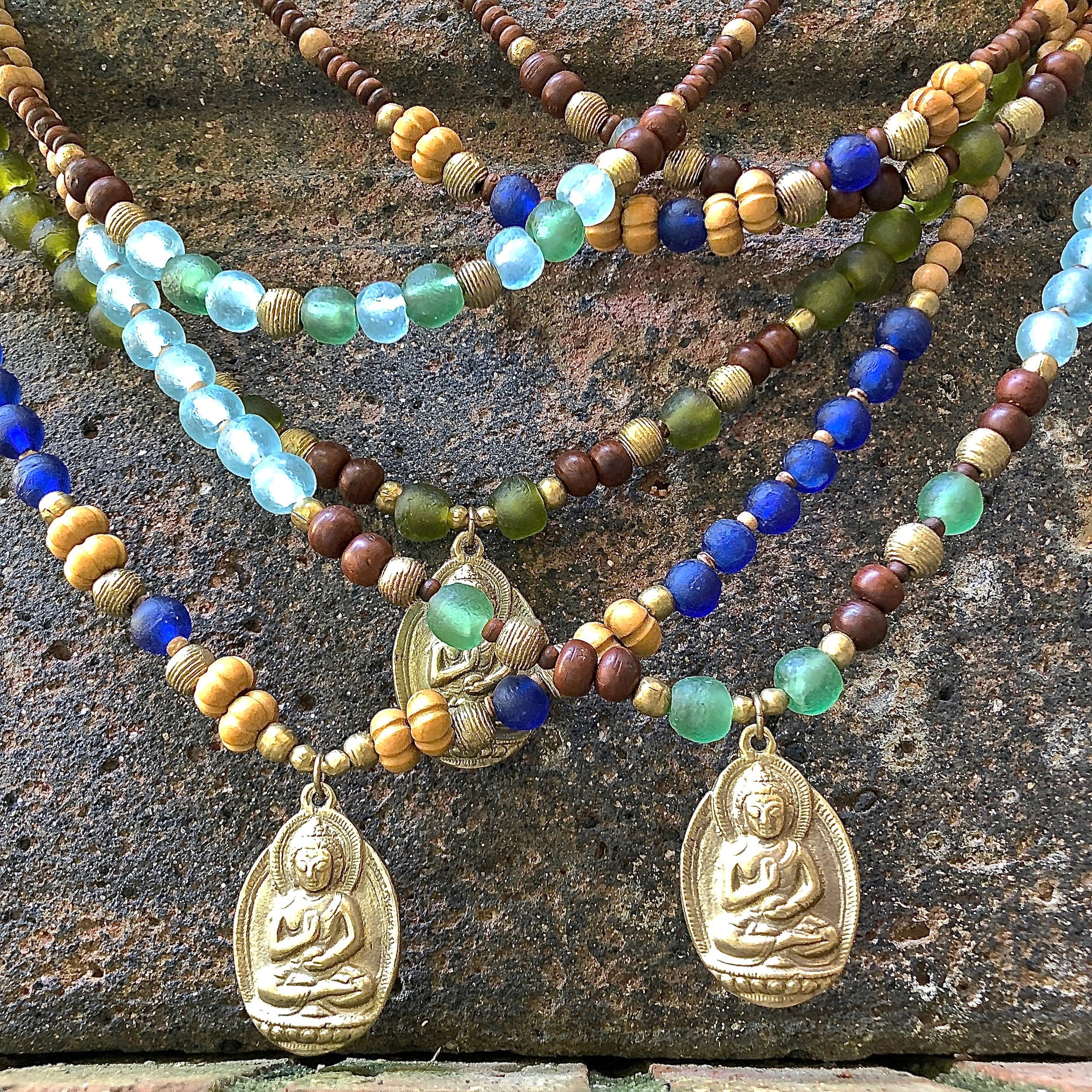 African recycled bottle beads brass Buddha double necklace. Cristina Tamames Jewelry Designer