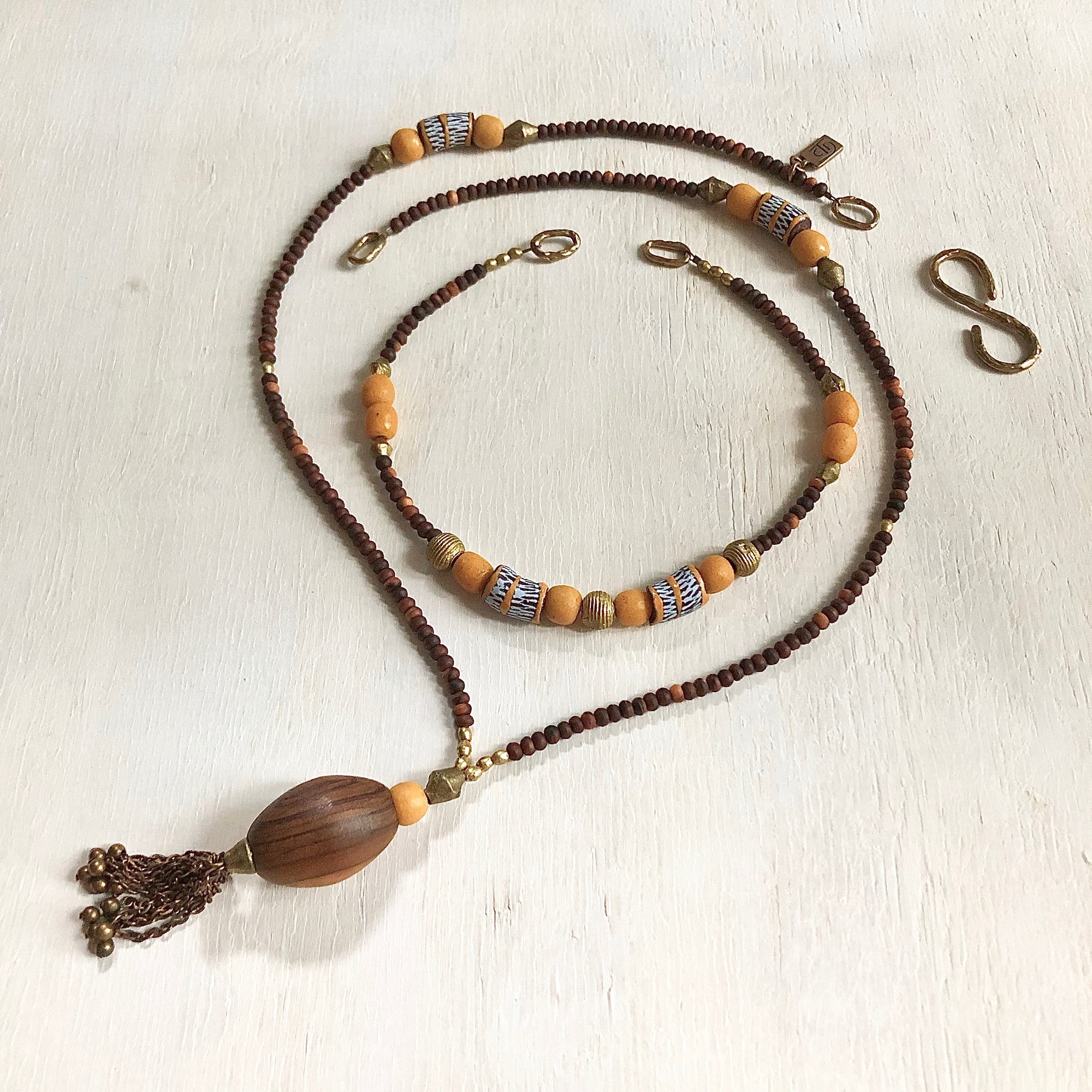 Hand painted brown yellow Adinkra African beads with vintage olive wood pendant long necklace. Cristina Tamames Jewelry Designer