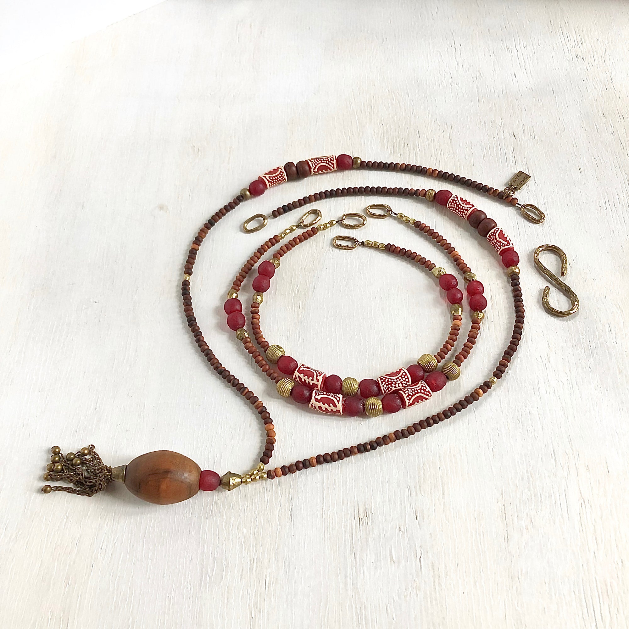 Hand painted red Adinkra African beads with vintage olive wood pendant long necklace. Cristina Tamames Jewelry Designer