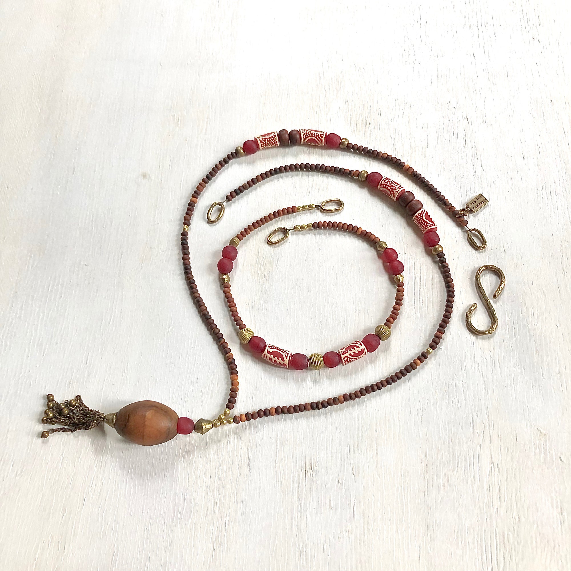 Hand painted red Adinkra African beads with vintage olive wood pendant long necklace. Cristina Tamames Jewelry Designer