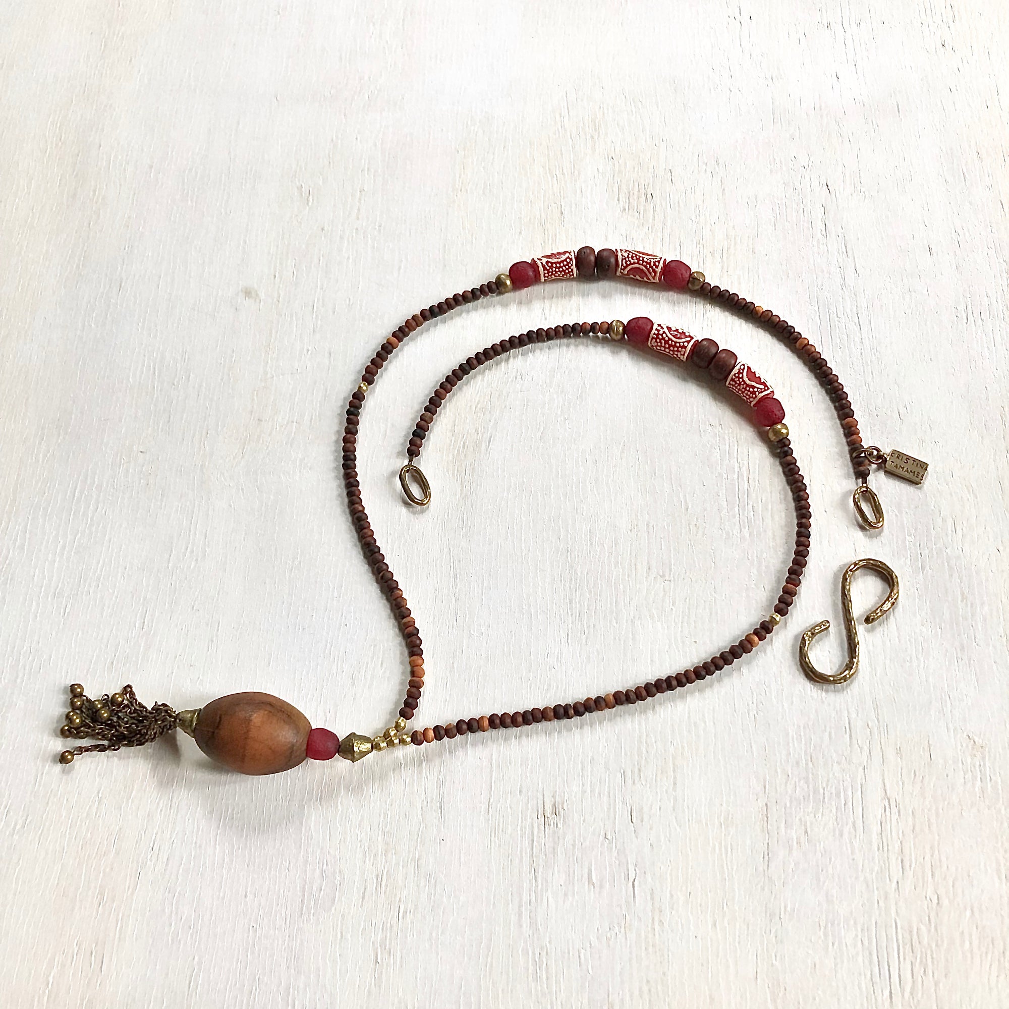 Hand painted red Adinkra African beads with vintage olive wood pendant long necklace. Cristina Tamames Jewelry Designer