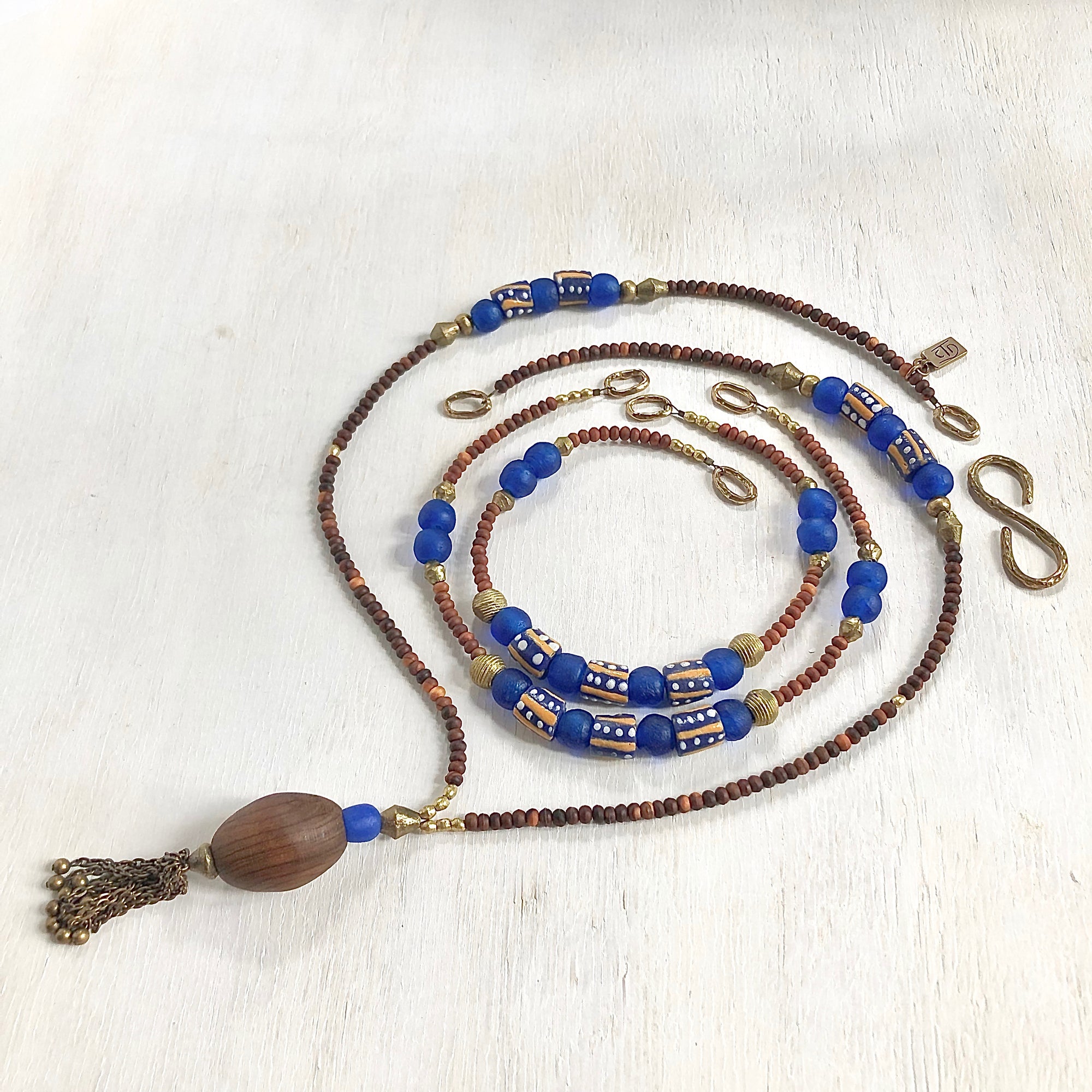 Hand painted blue yellow African beads with vintage olive wood pendant long necklace. Cristina Tamames Jewelry Designer