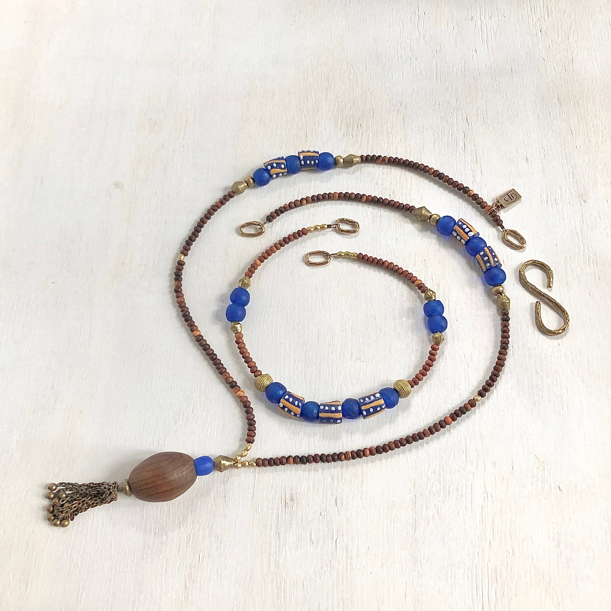 Hand painted blue yellow African beads with vintage olive wood pendant long necklace. Cristina Tamames Jewelry Designer