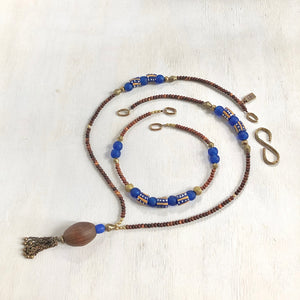 Hand painted blue yellow African beads with vintage olive wood pendant long necklace. Cristina Tamames Jewelry Designer