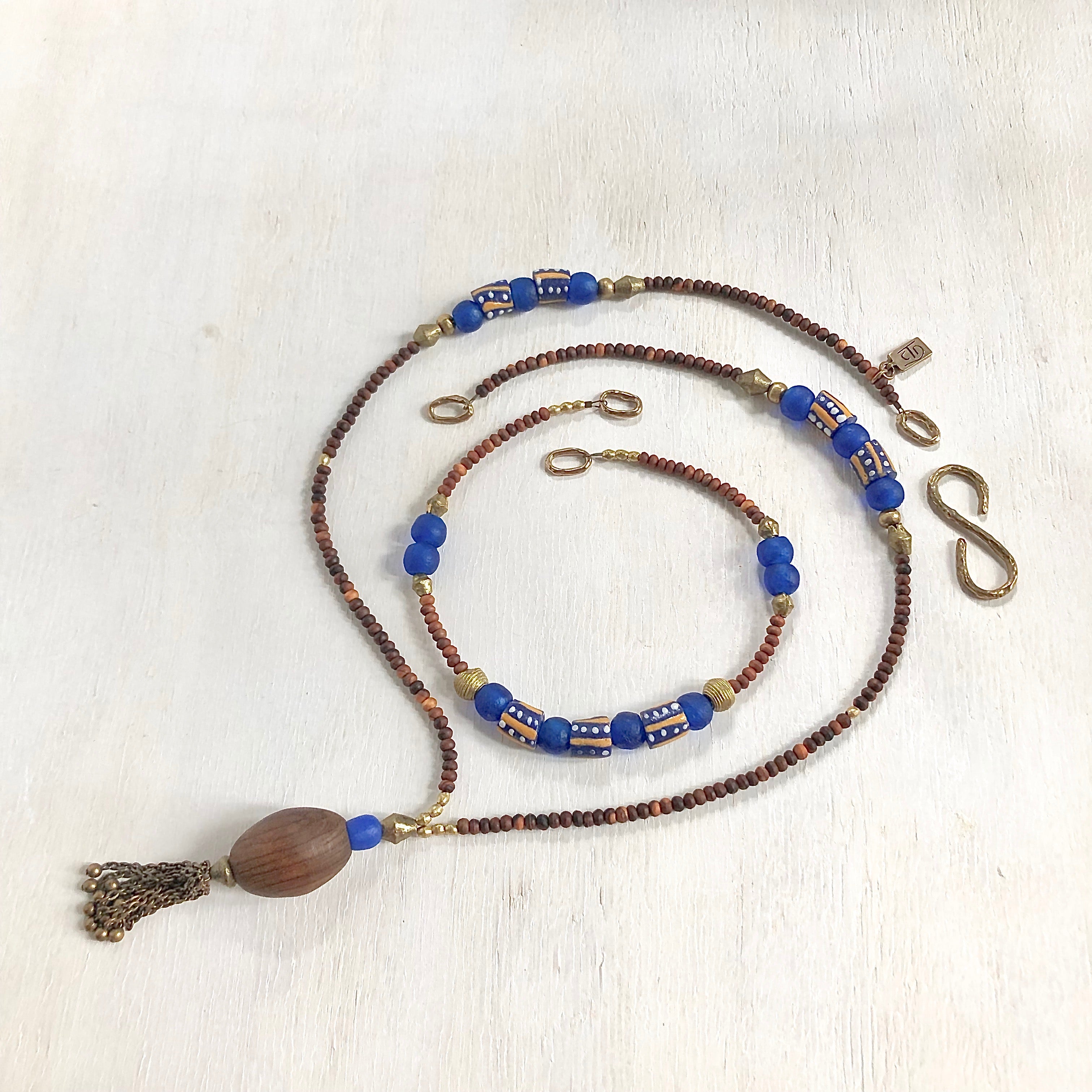 Hand painted blue yellow African beads with vintage olive wood pendant long necklace. Cristina Tamames Jewelry Designer
