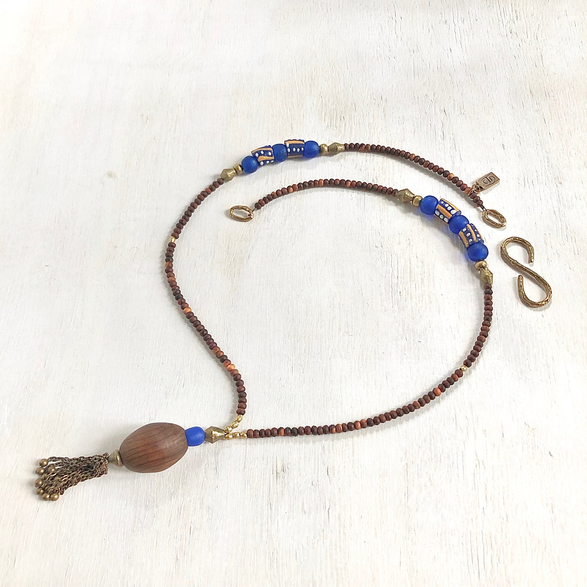 Hand painted blue yellow African beads with vintage olive wood pendant long necklace. Cristina Tamames Jewelry Designer