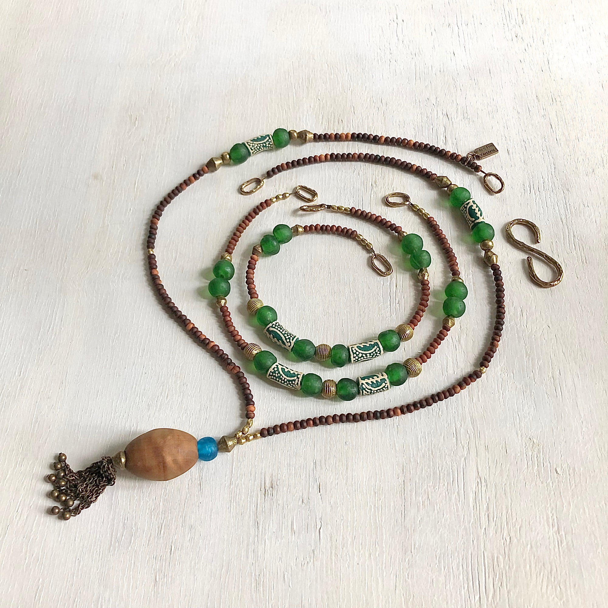 Hand painted green Adinkra African beads with vintage olive wood pendant long necklace. Cristina Tamames Jewelry Designer