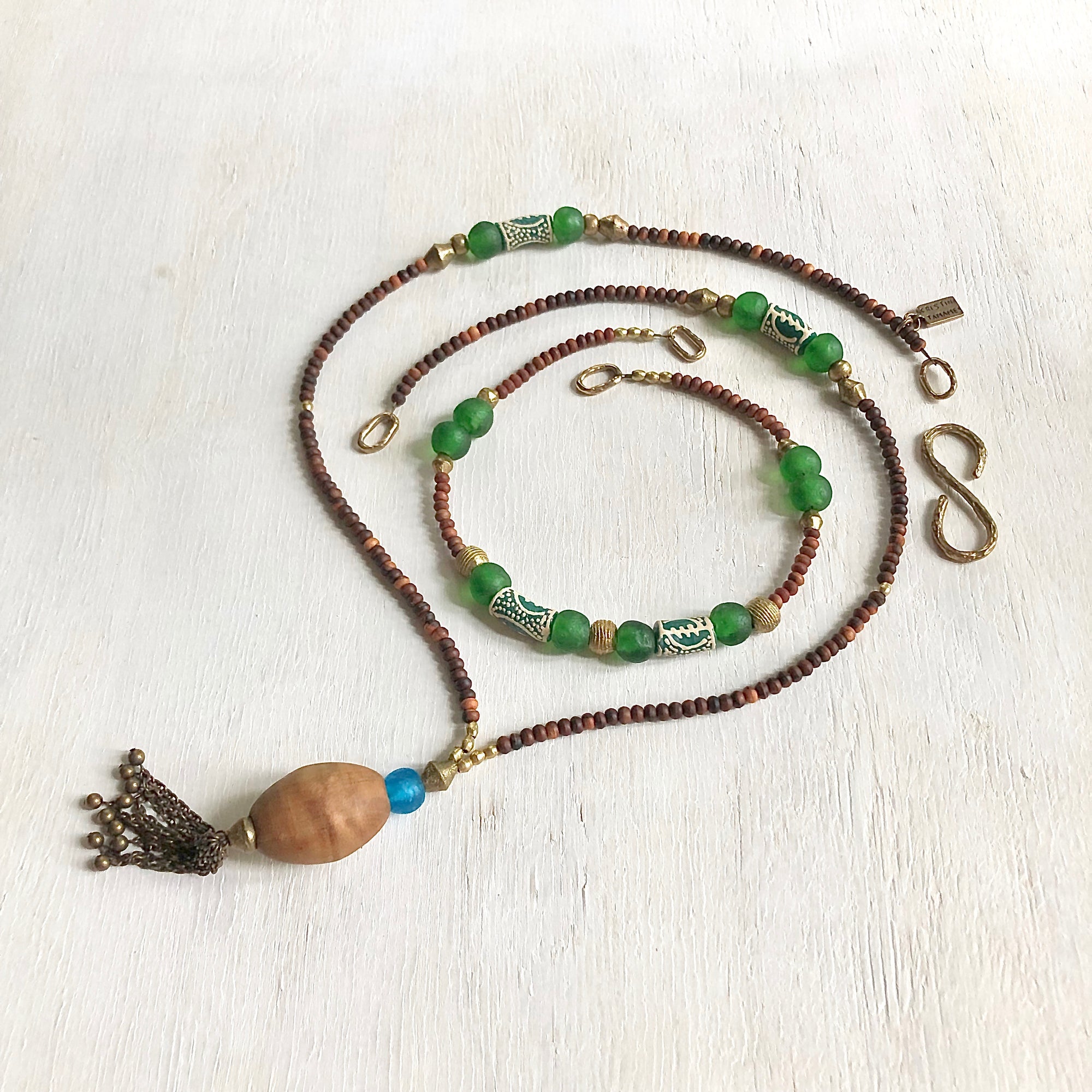 Hand painted green Adinkra African beads with vintage olive wood pendant long necklace. Cristina Tamames Jewelry Designer