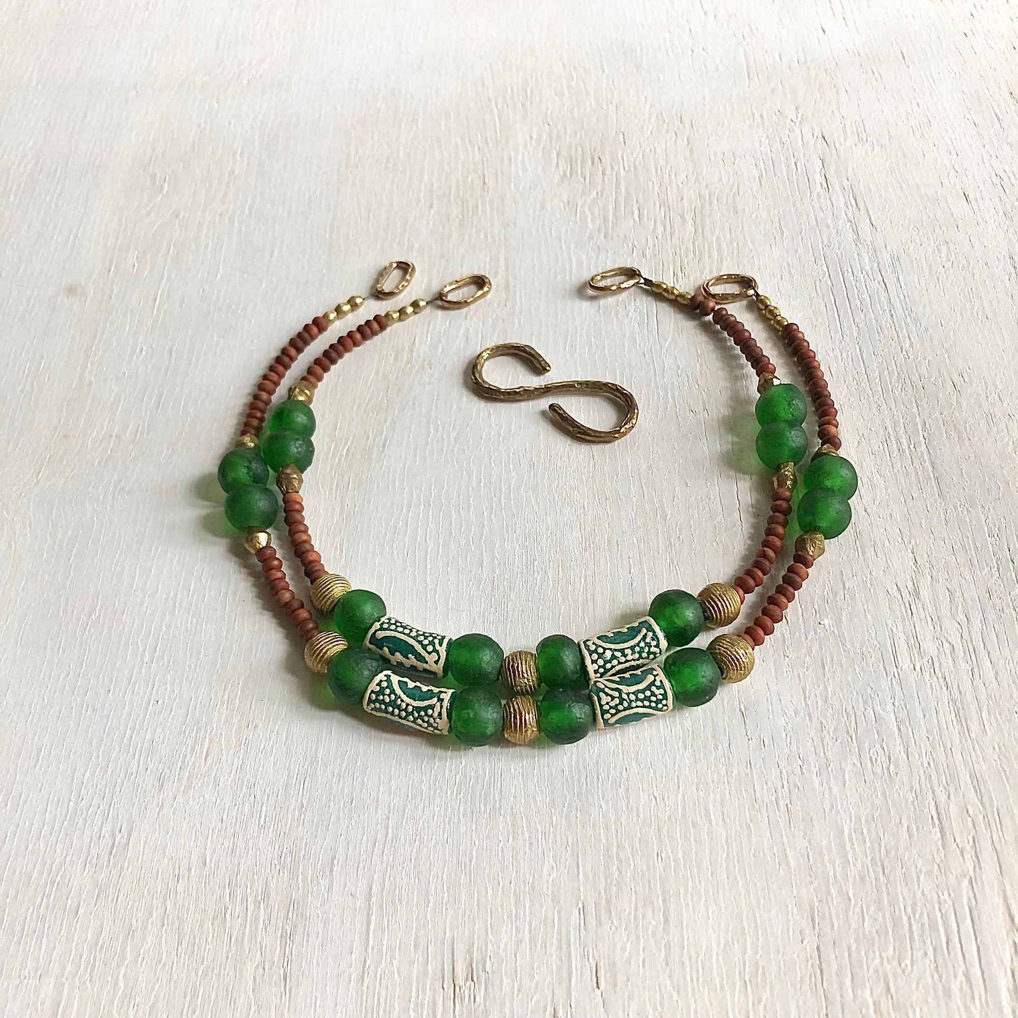 Hand painted green Adinkra African beads with vintage olive wood pendant long necklace. Cristina Tamames Jewelry Designer