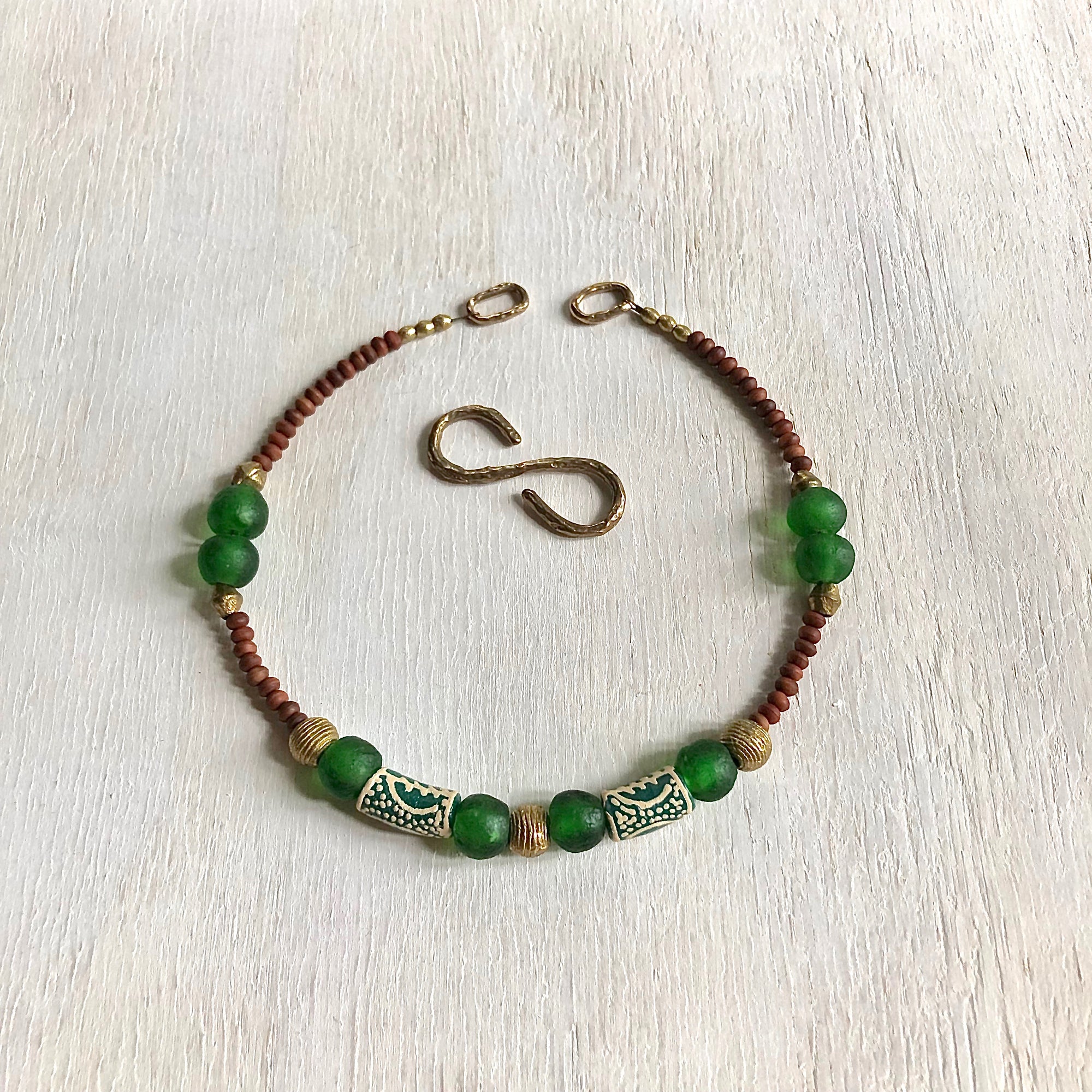 Hand painted green Adinkra African beads with vintage olive wood pendant long necklace. Cristina Tamames Jewelry Designer