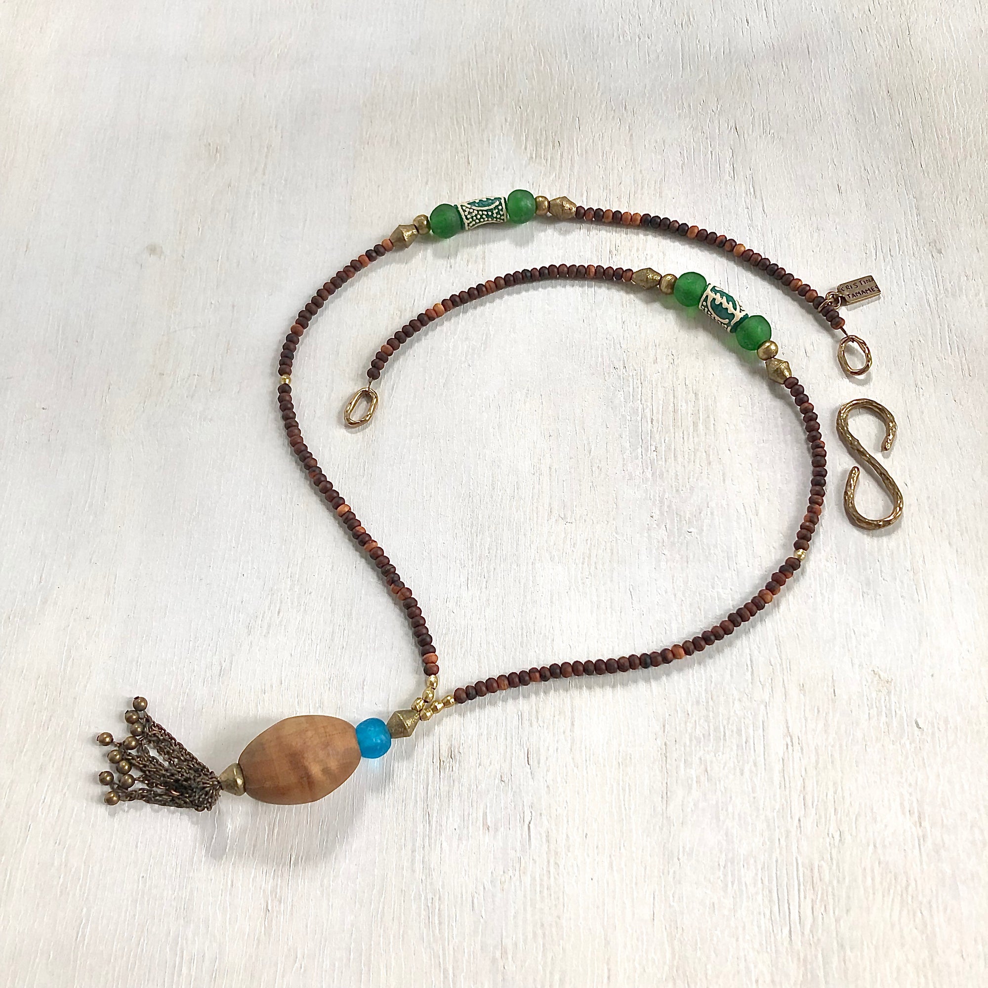 Hand painted green Adinkra African beads with vintage olive wood pendant long necklace. Cristina Tamames Jewelry Designer