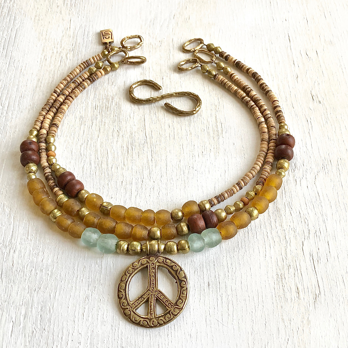 African recycled bottle beads peace necklace. Cristina Tamames Jewelry designer