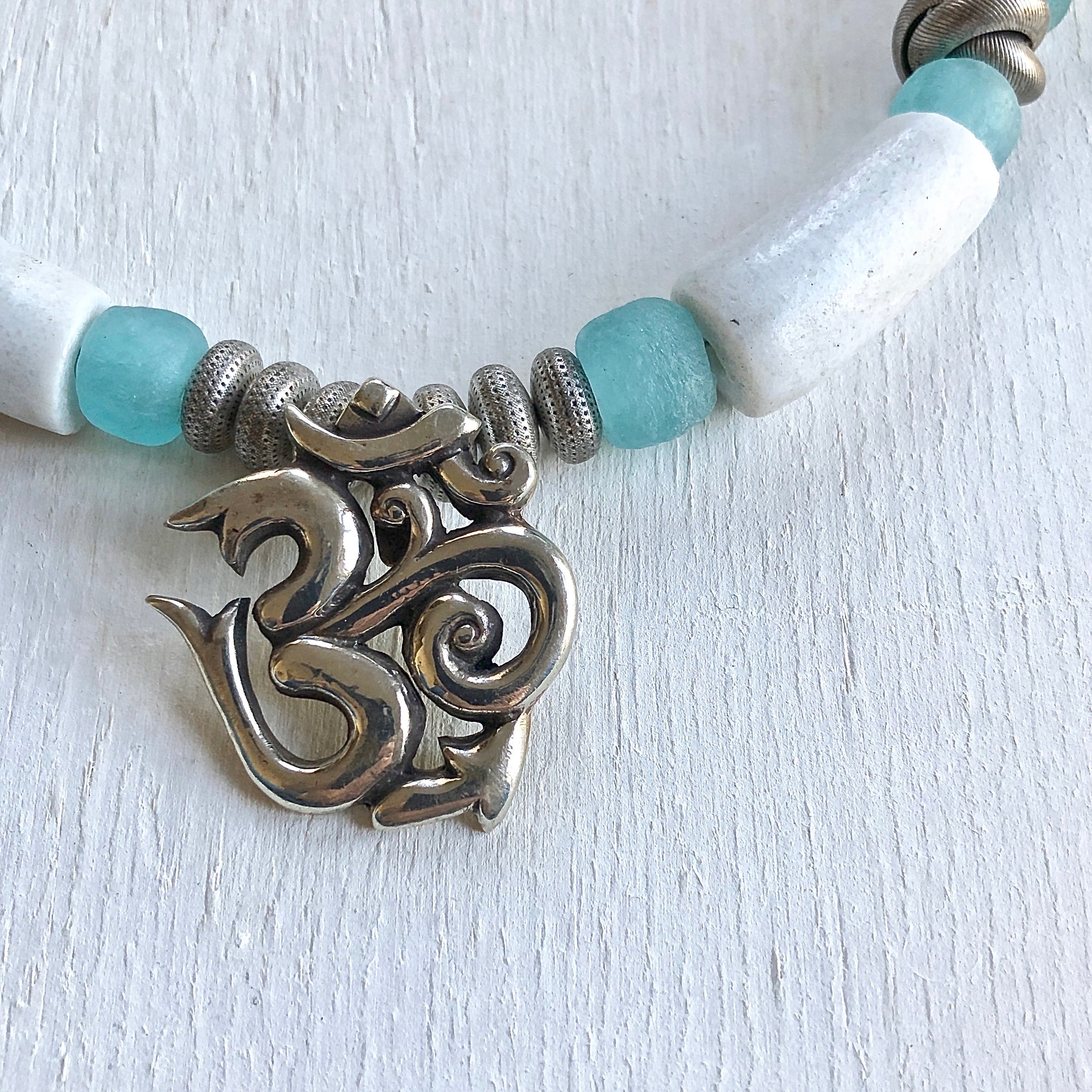 Nepalese silver Om pendant African beads necklace. Cristina Tamames Jewelry Designer