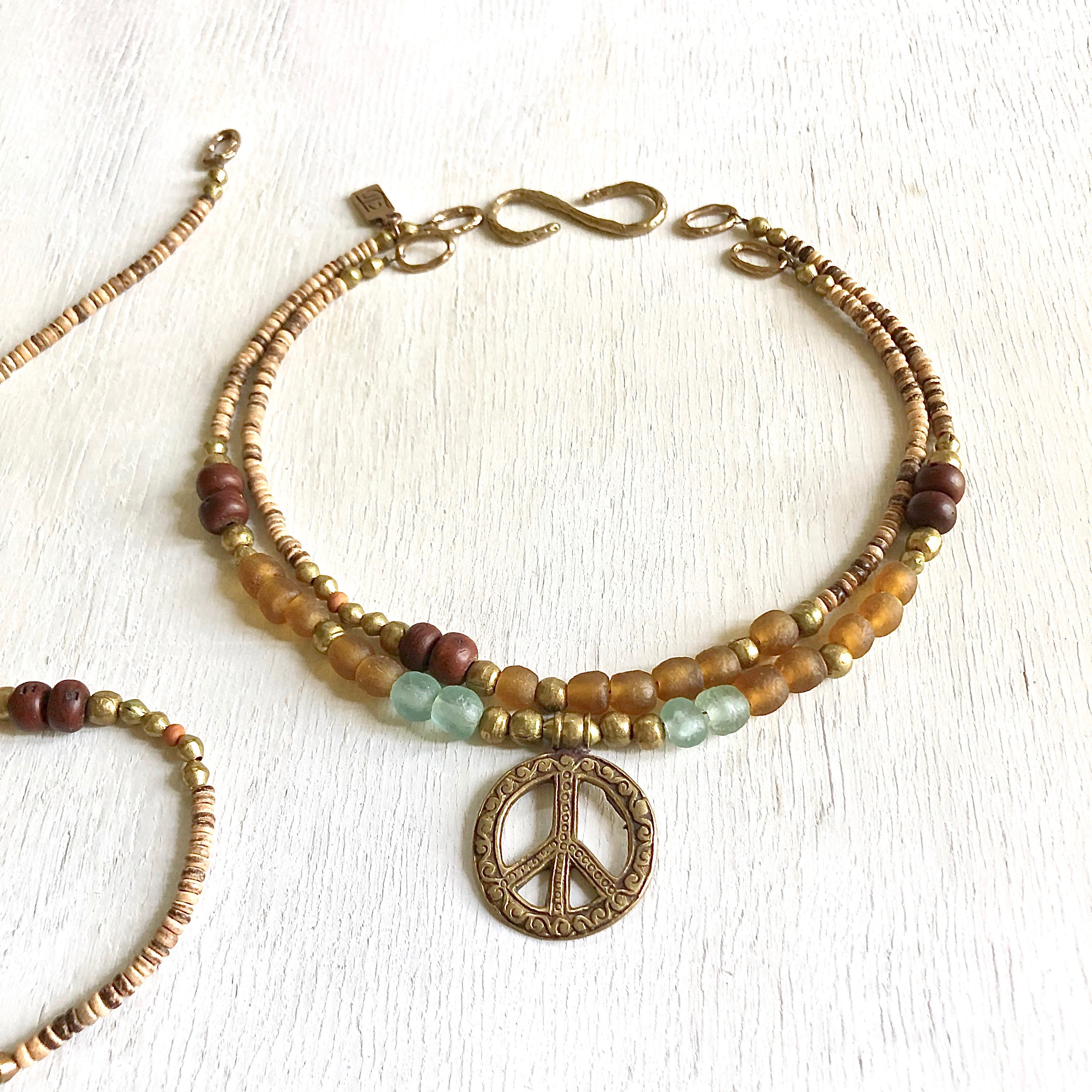 African recycled bottle beads peace necklace. Cristina Tamames Jewelry designer