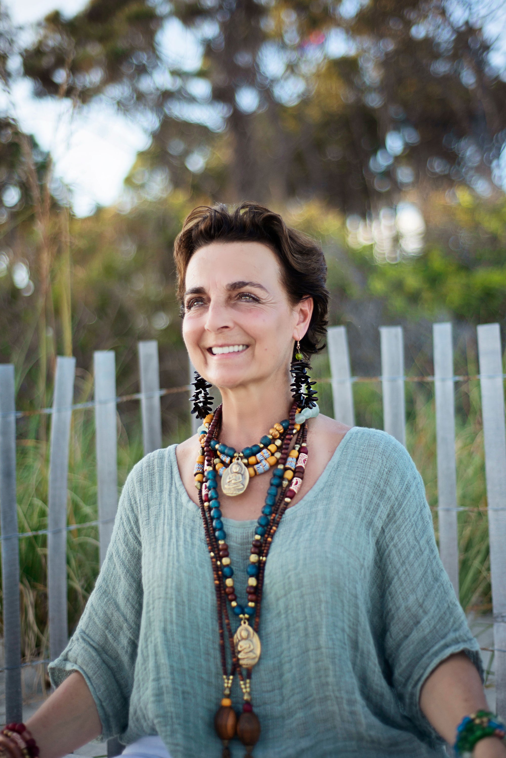 Hand painted brown yellow Adinkra African beads with vintage olive wood pendant long necklace. Cristina Tamames Jewelry Designer